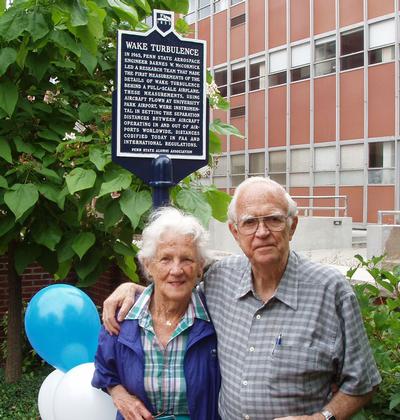 Emily and Barney McCormick in front of the wake turbulence historical marker