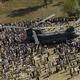 Pakistani earthquake victims crowd around a U.S. Army CH-47 Chinook helicopter delivering disaster relief supplies to the earthquake devastated area surrounding the town of Oghi, Pakistan, on Oct. 17, 2005.